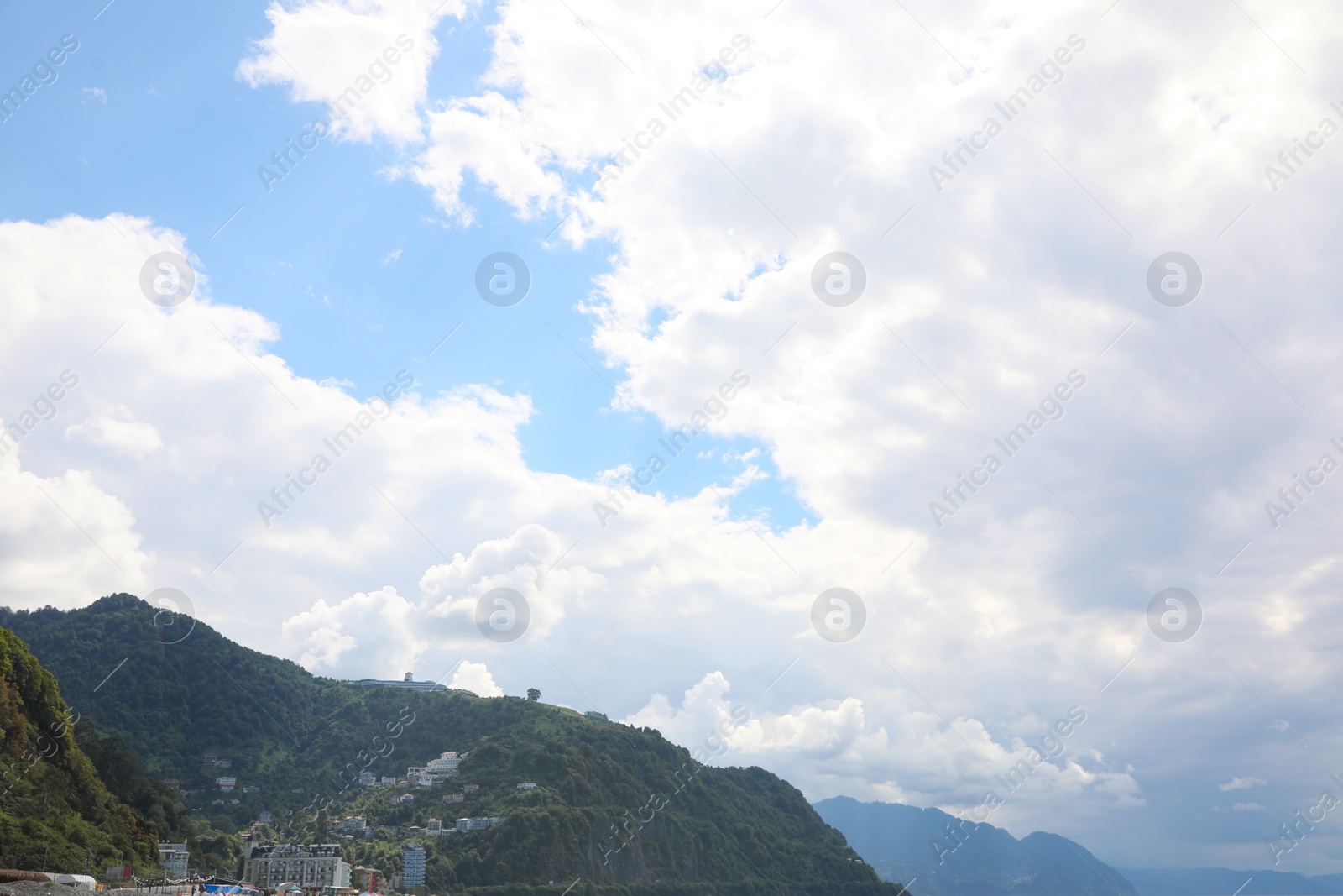 Photo of Picturesque view of mountain under beautiful sky with fluffy clouds