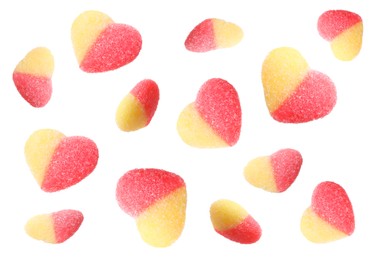 Image of Tasty heart shaped gummy candies falling on white background. Jelly sweet
