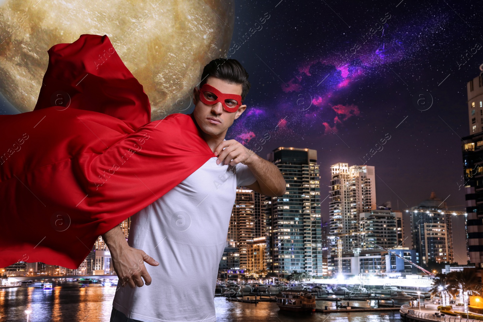 Image of Man wearing superhero costume and beautiful cityscape in night on background