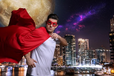 Image of Man wearing superhero costume and beautiful cityscape in night on background