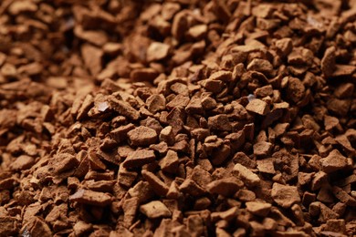Photo of Dry instant coffee as background, closeup view