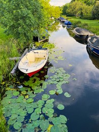 Photo of Beautiful view of moored boats in canal on sunny day