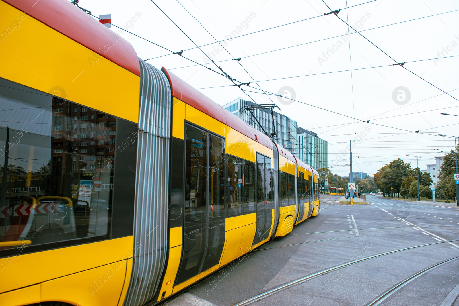 Photo of Modern tram on city street. Public transport