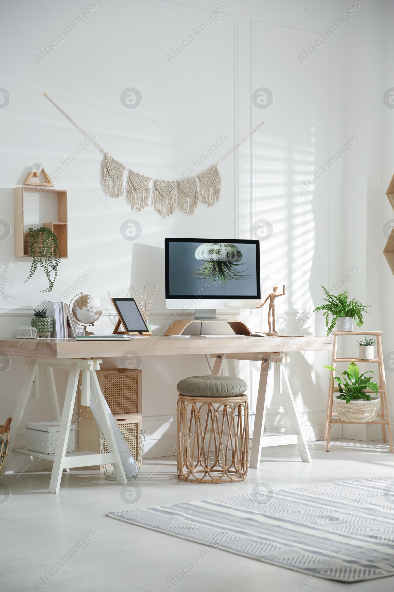 Photo of Stylish home office interior with comfortable workplace