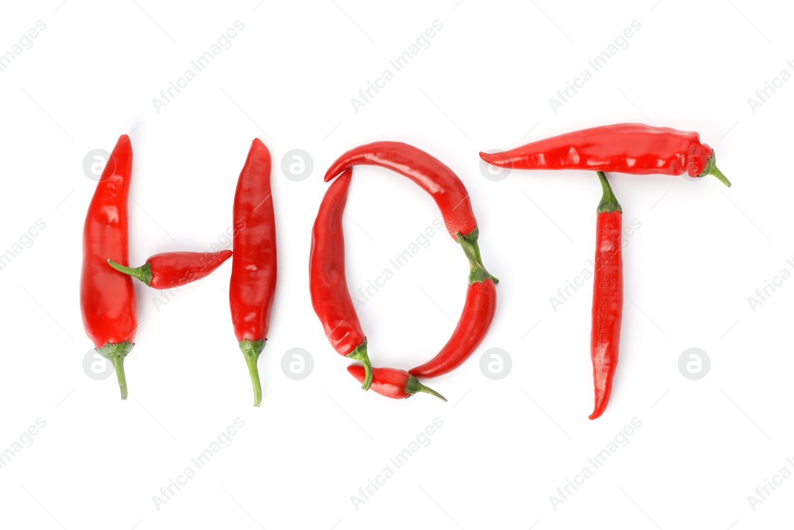 Photo of Word HOT made with red chili peppers on white background, top view