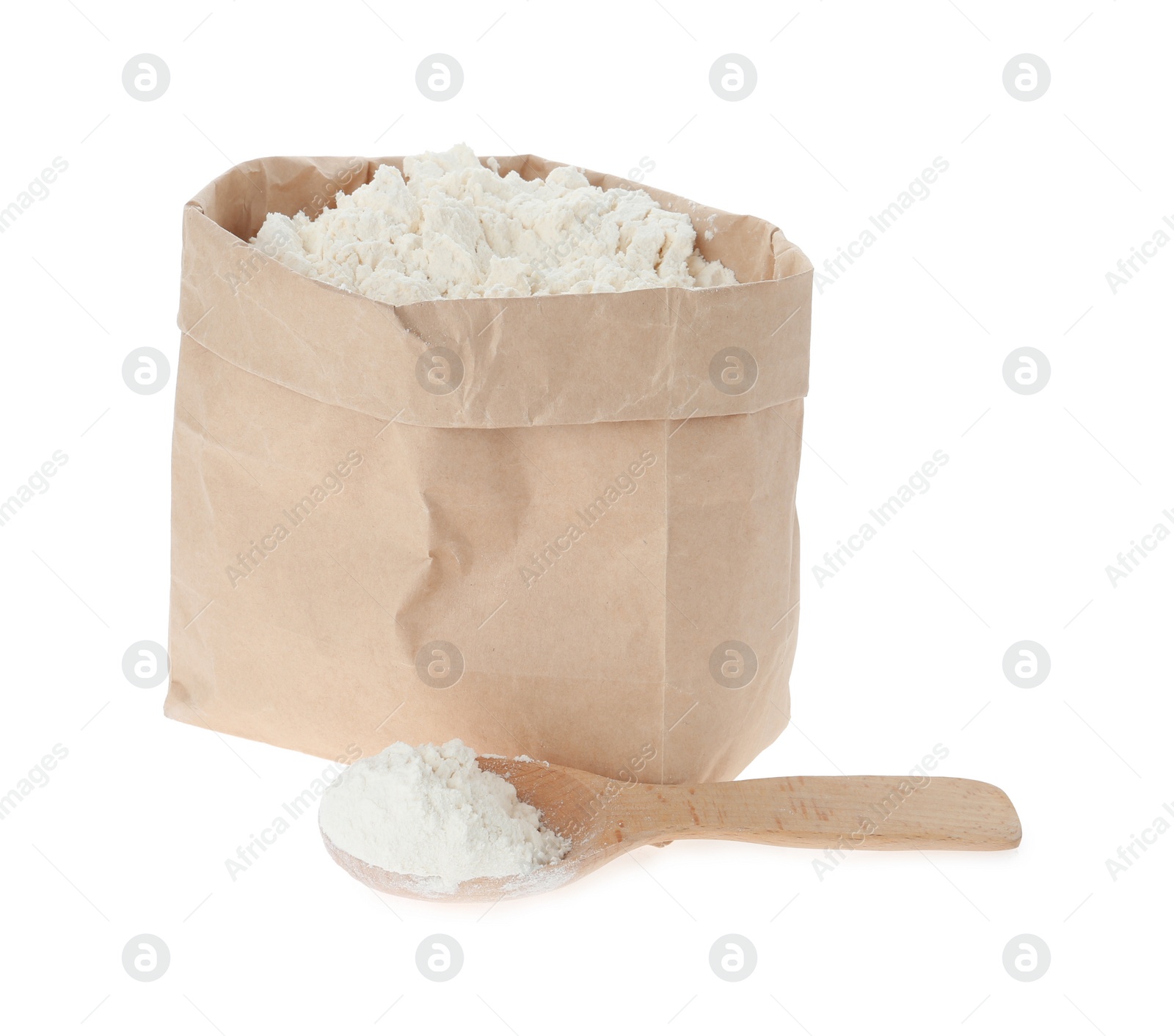 Photo of Paper bag and spoon with flour isolated on white