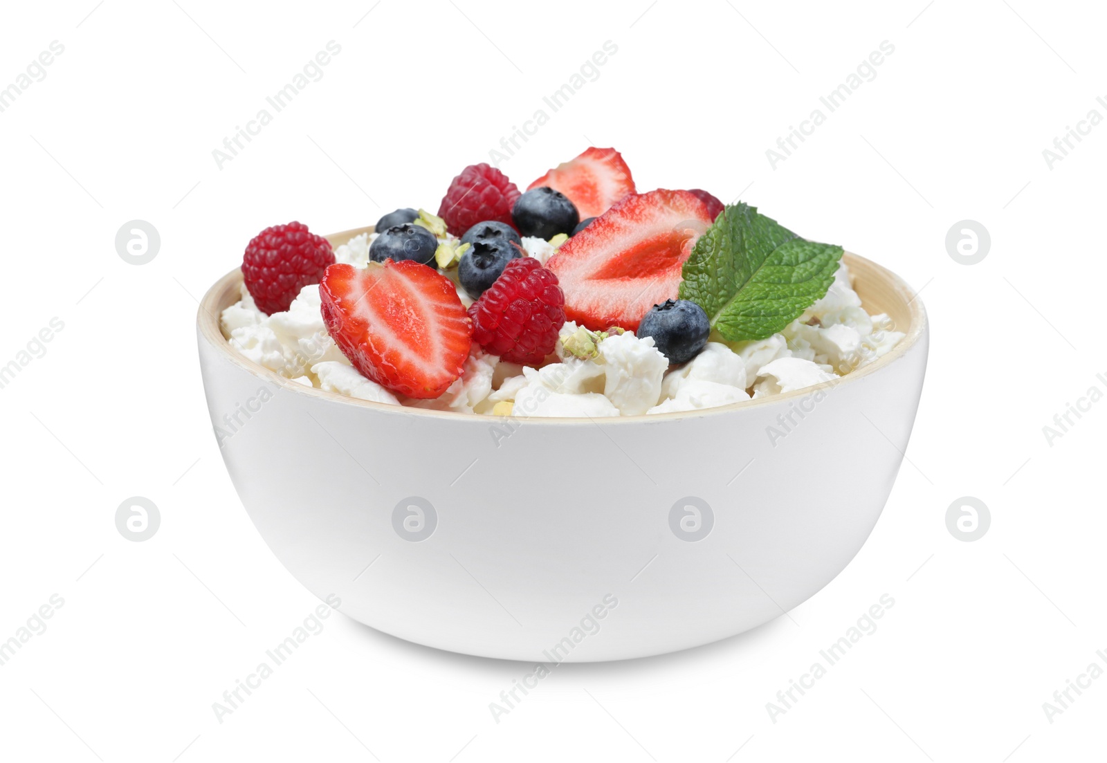 Photo of Fresh cottage cheese with berries and mint in bowl isolated on white