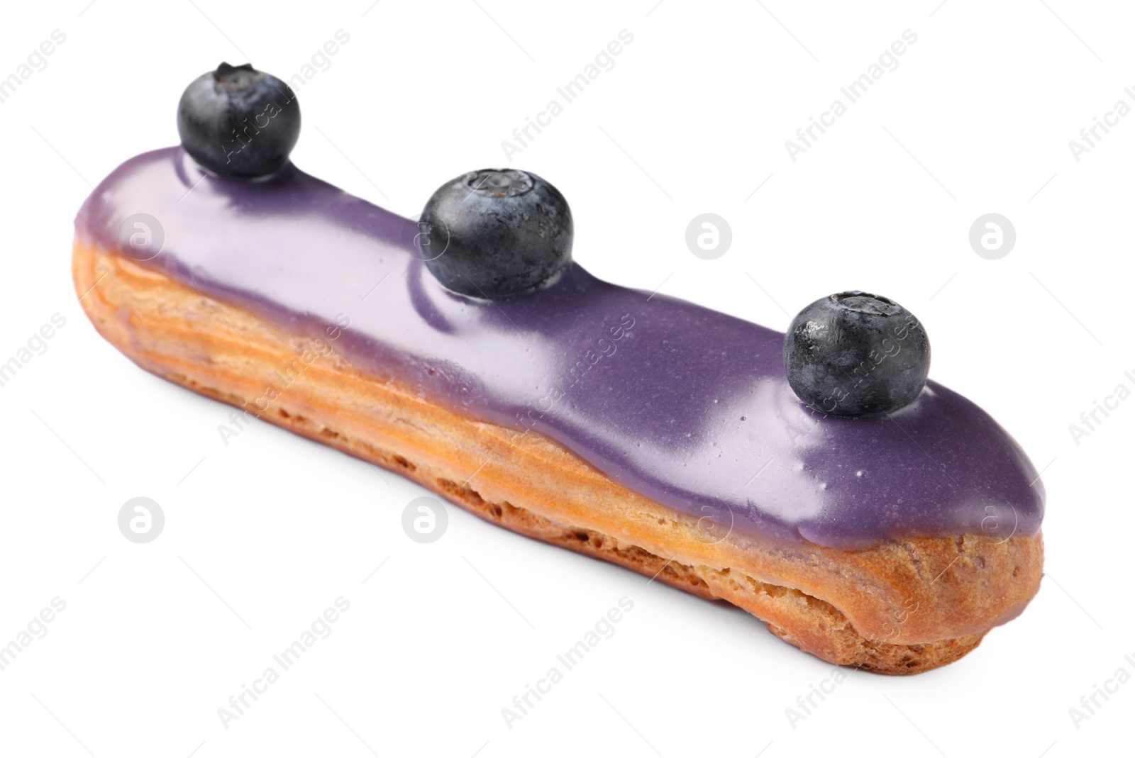 Photo of Delicious eclair decorated with blueberries isolated on white