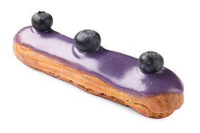 Photo of Delicious eclair decorated with blueberries isolated on white