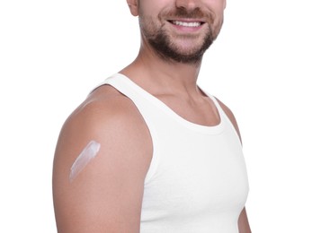 Photo of Man with sun protection cream on his shoulder against white background, closeup