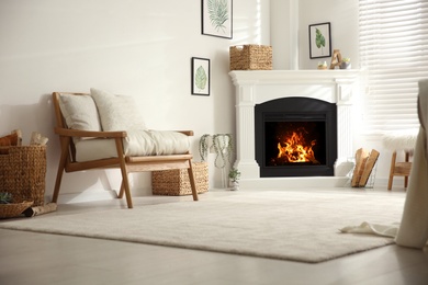 Photo of Bright living room interior with fireplace and armchair