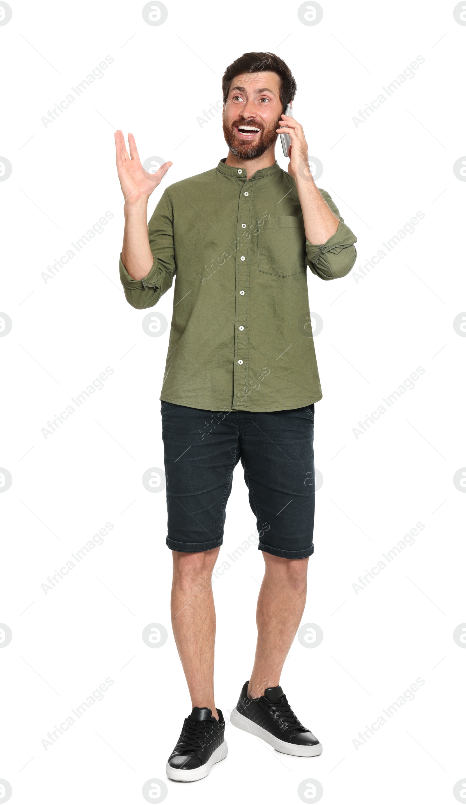 Photo of Emotional man talking on phone against white background