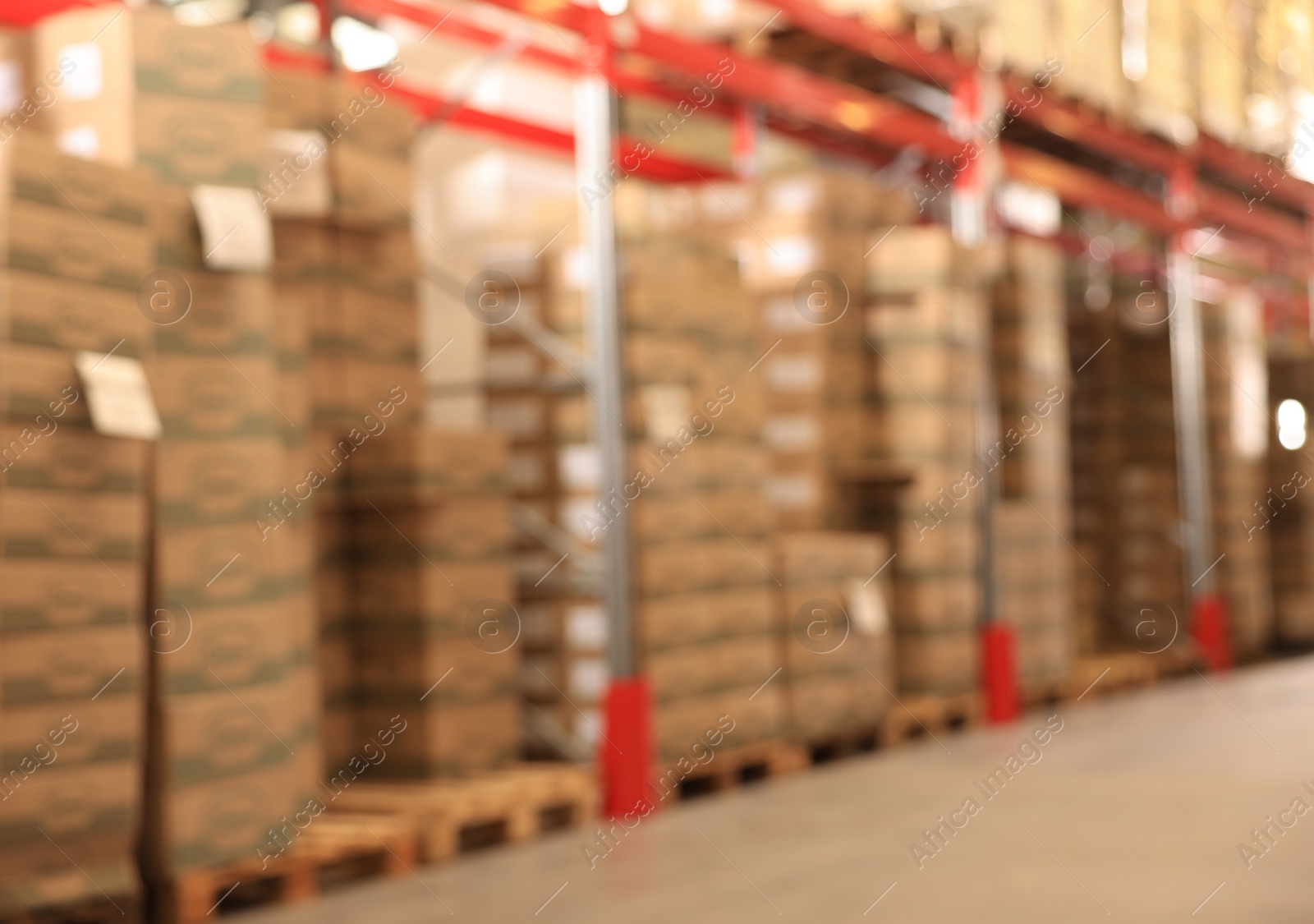 Image of Warehouse with lots of products, blurred view. Wholesale business