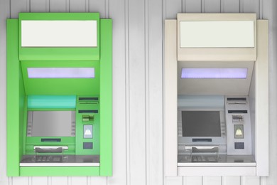 Photo of Modern automated cash machines with screens outdoors
