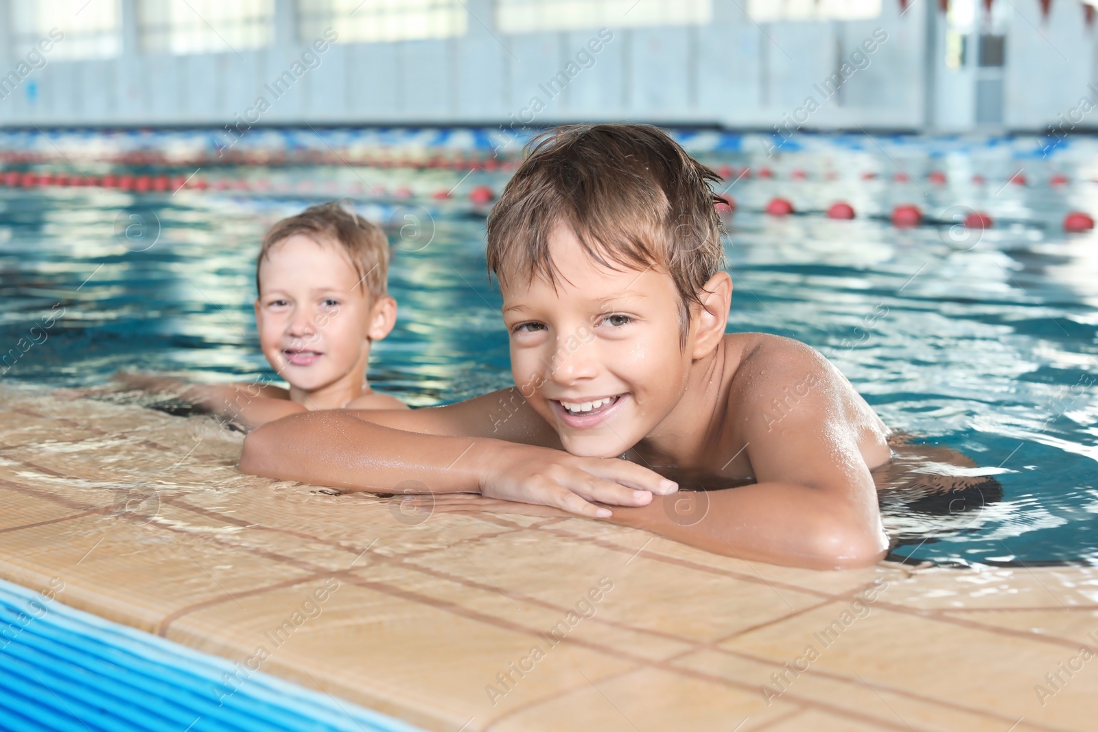 Photo of Cute little boys in indoor swimming pool