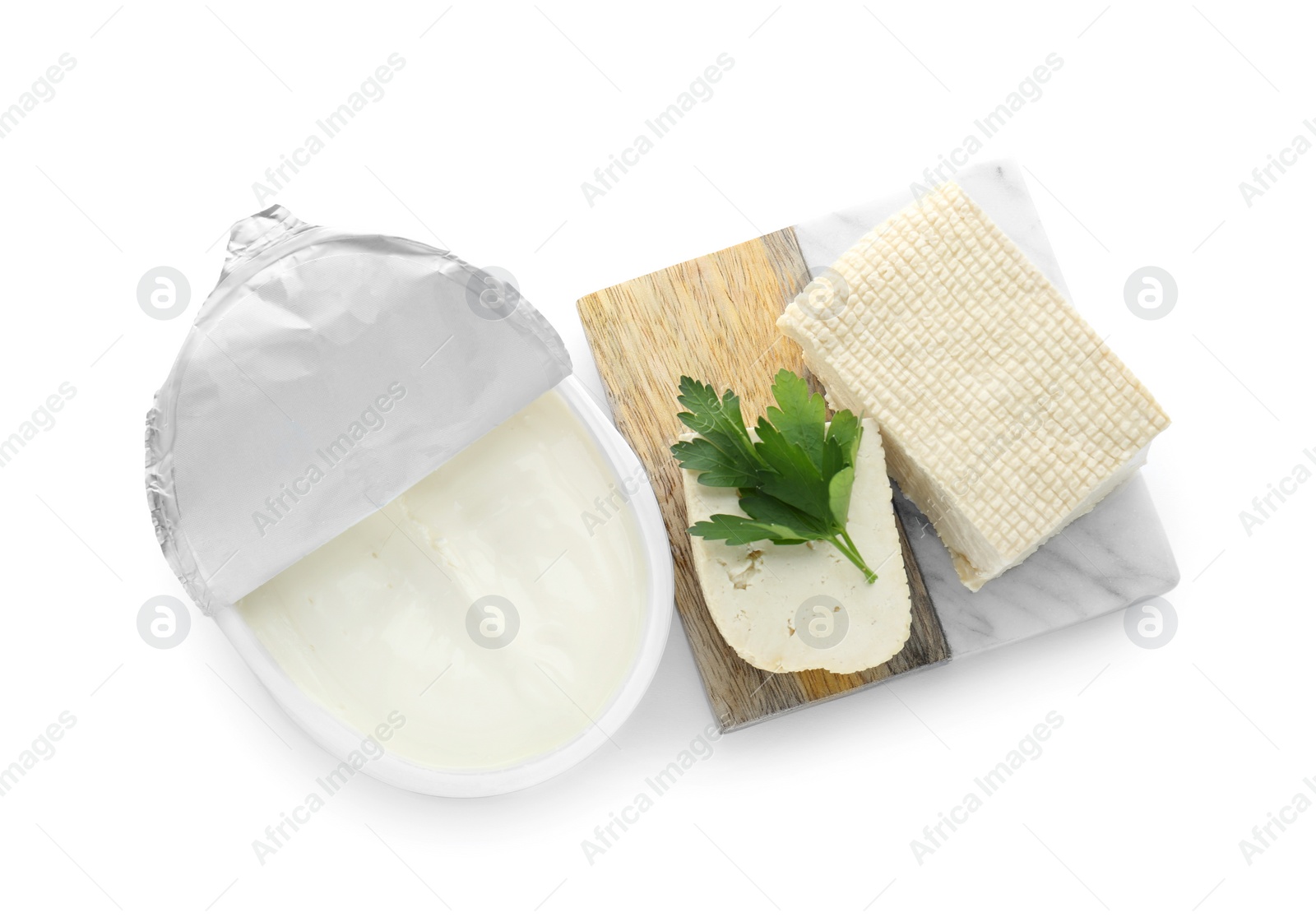 Photo of Tasty tofu, cream cheese and parsley leaf on white background, top view