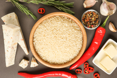 Photo of Flat lay composition with different ingredients on grey background. Risotto recipe