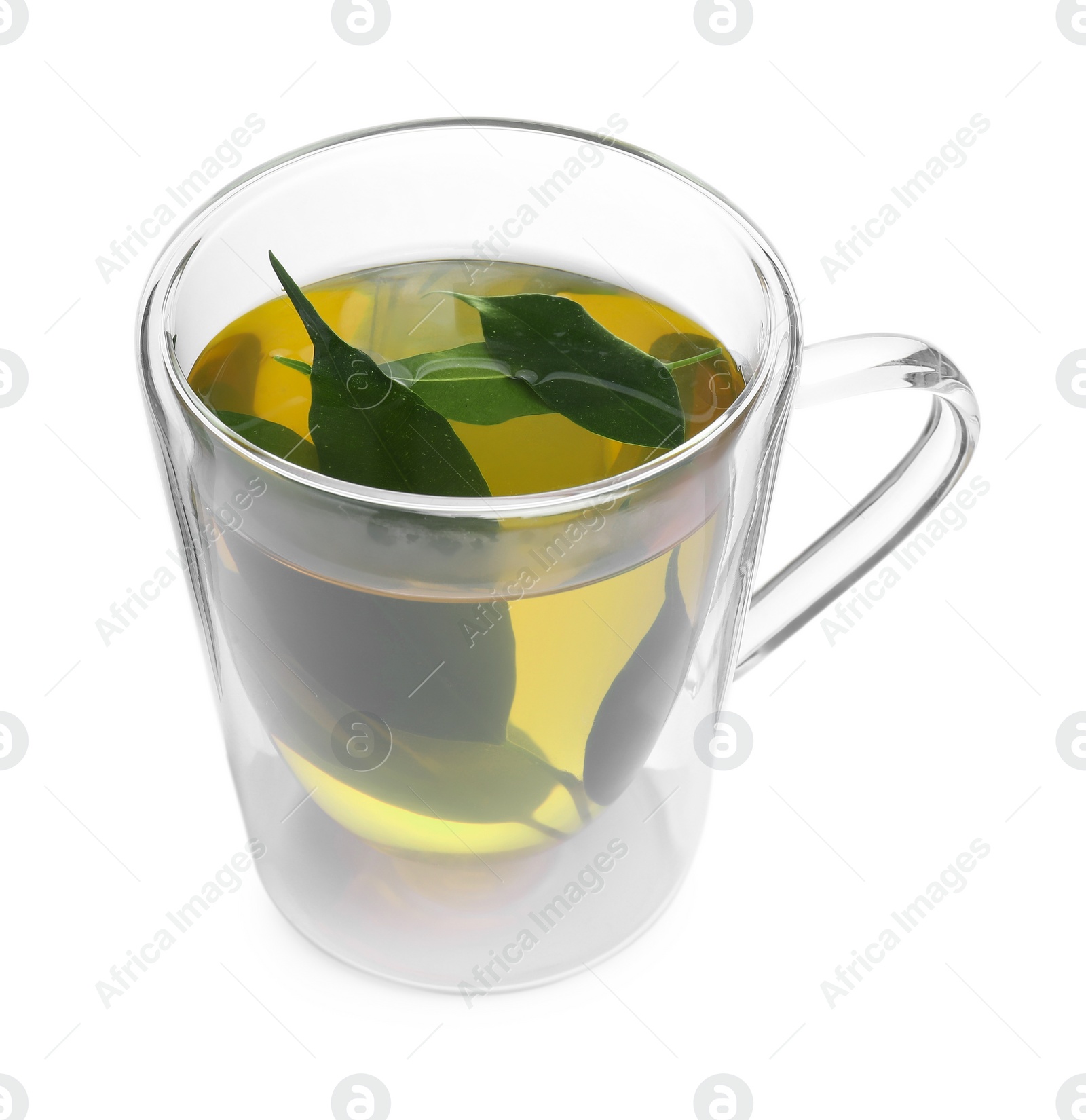 Photo of Fresh green tea in glass mug and leaves isolated on white