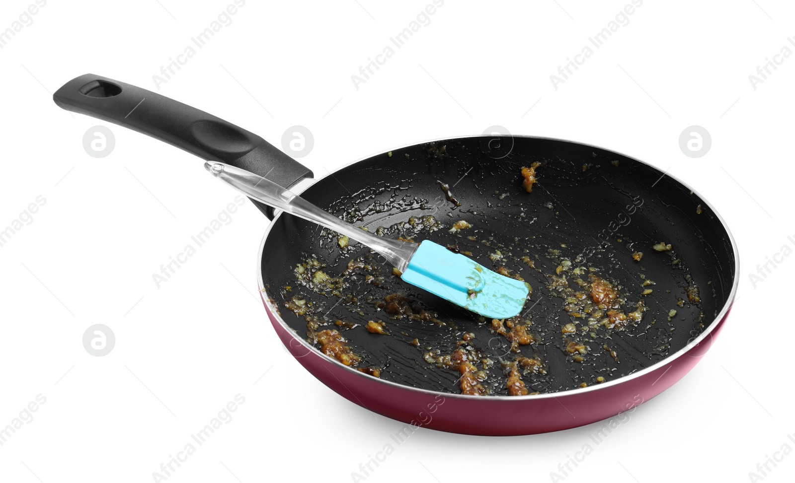 Photo of Dirty frying pan and spatula on white background
