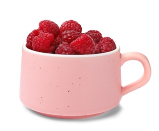 Photo of Mug with ripe raspberries on white background