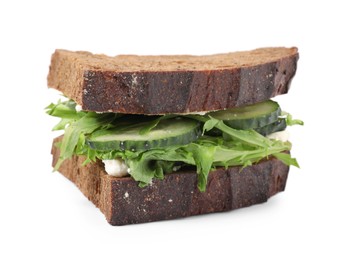 Tasty sandwich with cream cheese, cucumber and greens on white background