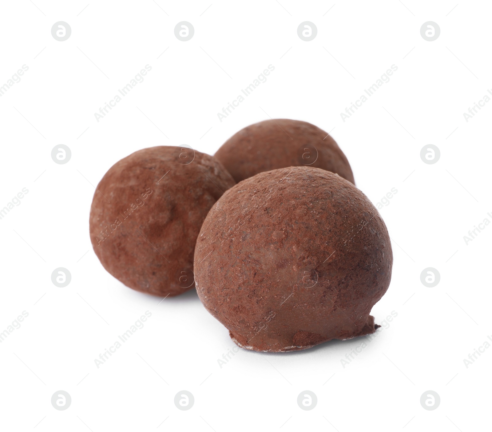 Photo of Delicious chocolate truffle candies isolated on white