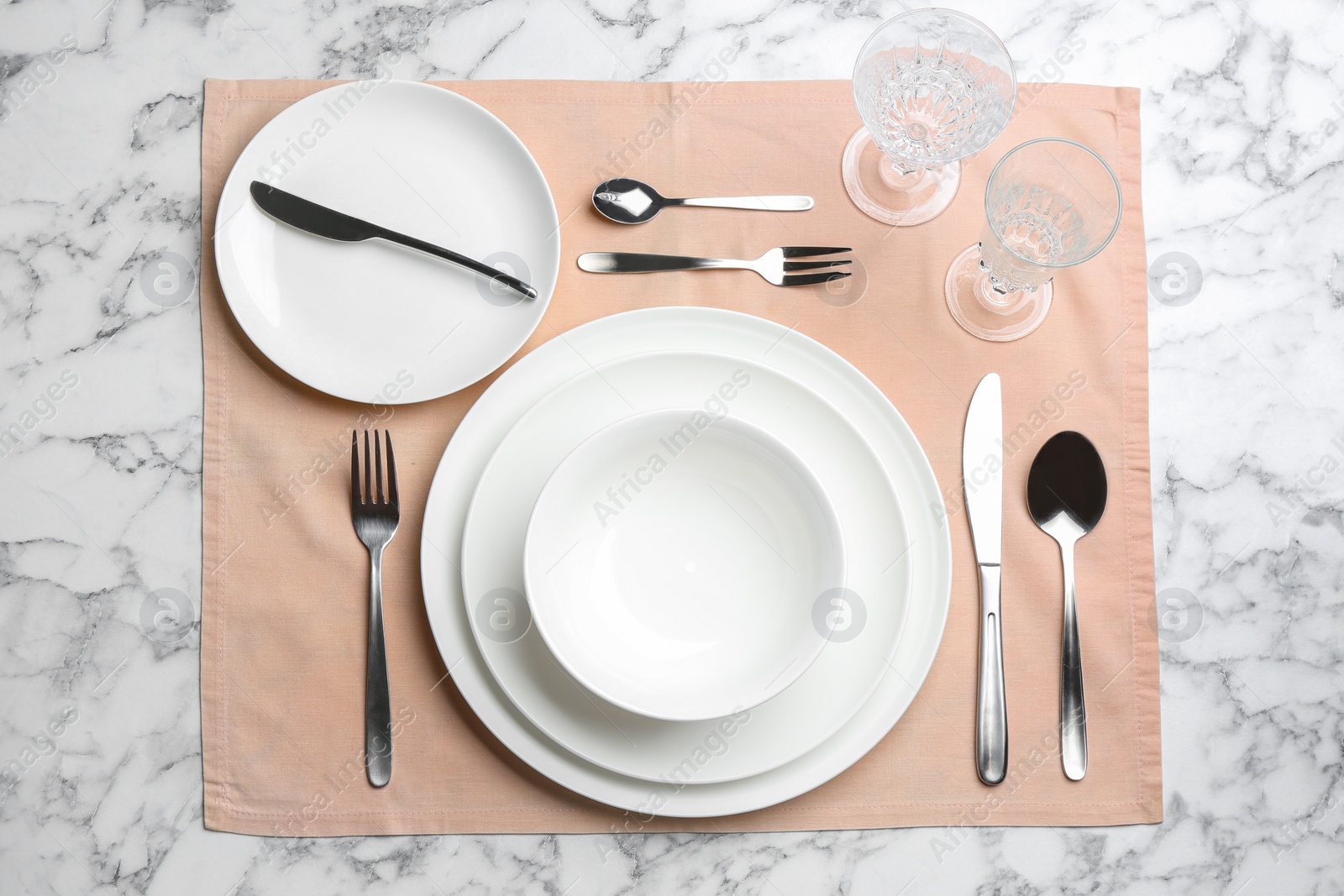 Photo of Elegant table setting on white marble background, flat lay