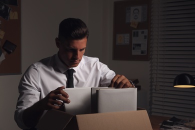 Photo of Professional detective doing paperwork in his office