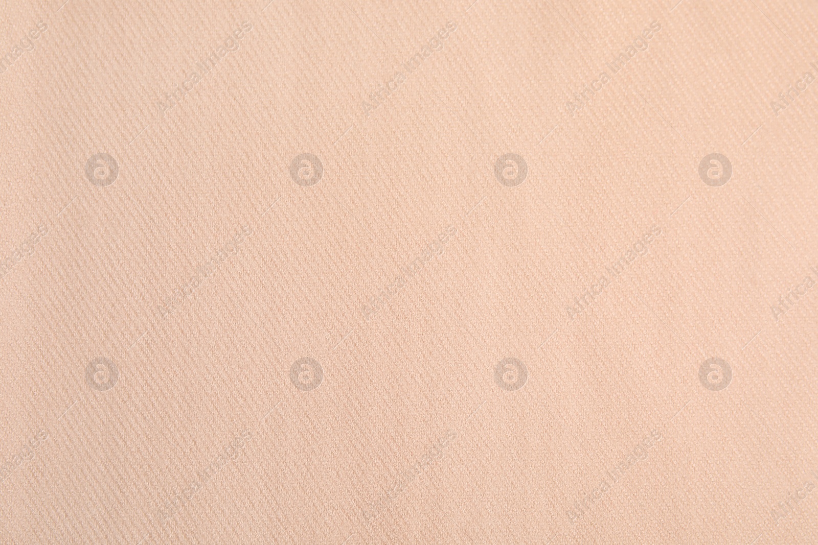 Photo of Beige soft cashmere fabric as background, closeup