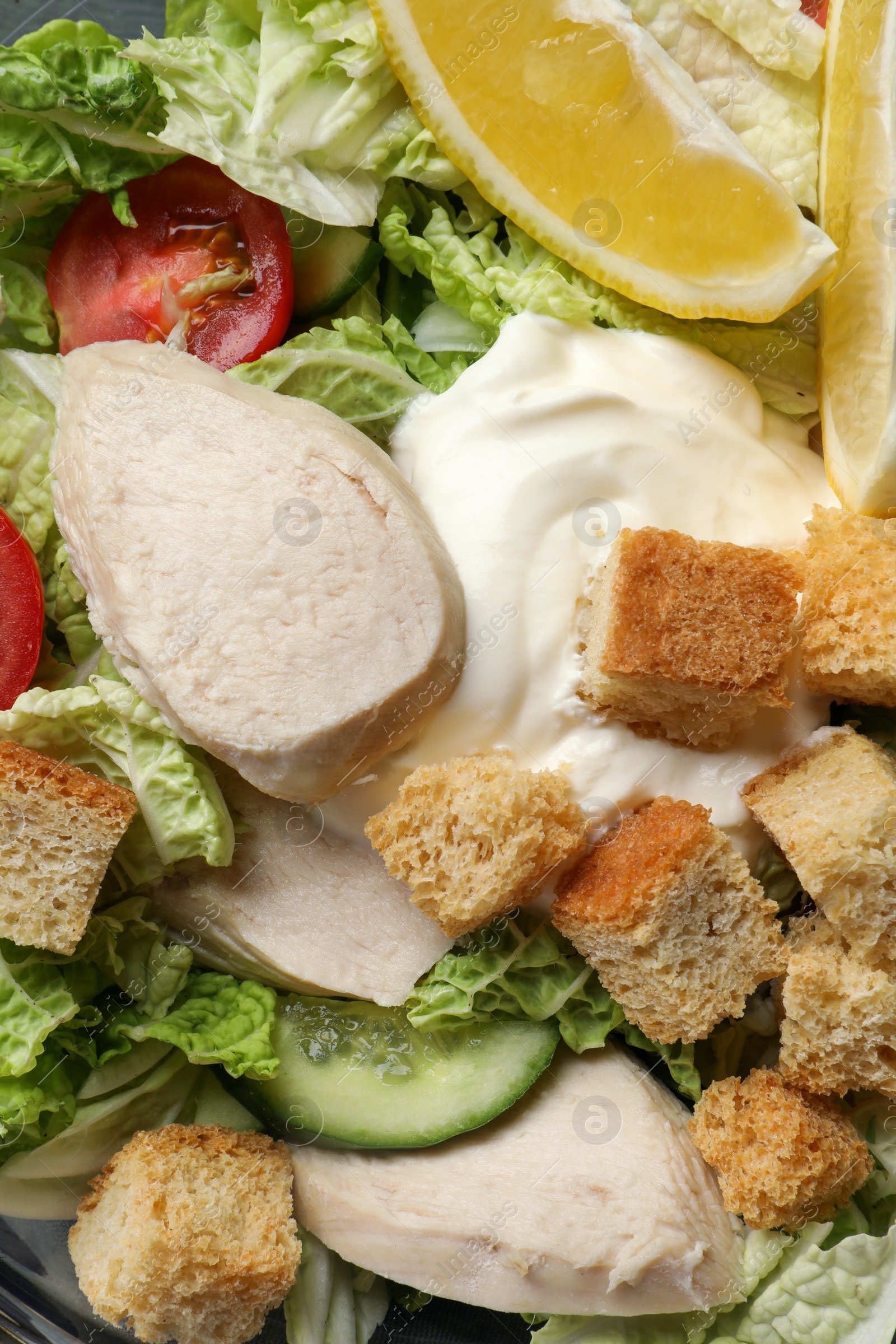 Photo of Delicious salad with Chinese cabbage, meat and bread croutons as background, top view