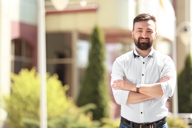 Photo of Portrait of young man in stylish outfit outdoors