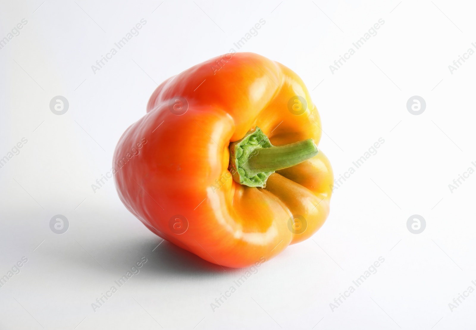 Photo of Raw ripe paprika pepper on white background