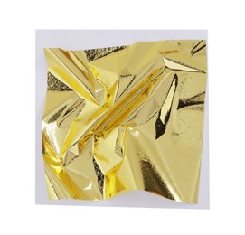 Edible gold leaf sheet isolated on white