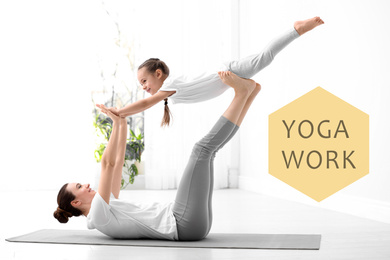 Image of Mother and daughter practicing yoga at home