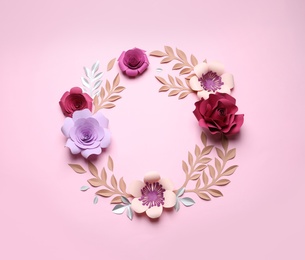 Frame of beautiful paper flowers on pink background, flat lay. Space for text
