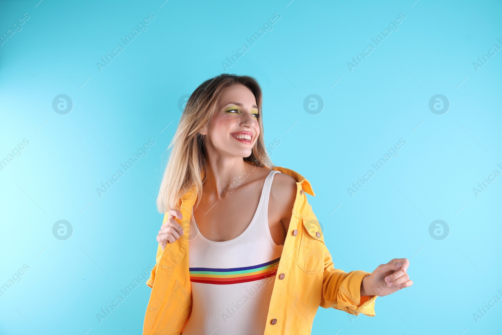 Photo of Beautiful young woman posing on color background. Summer fashion