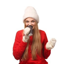 Photo of Portrait of young woman in stylish hat and sweater with paper coffee cup on white background. Winter atmosphere