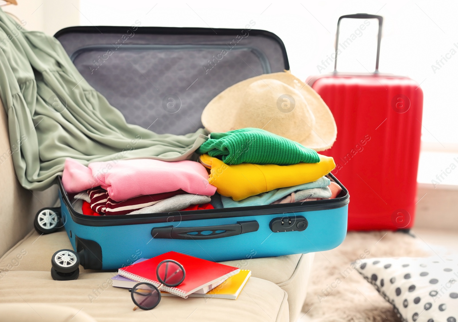 Photo of Packed travel suitcases indoors