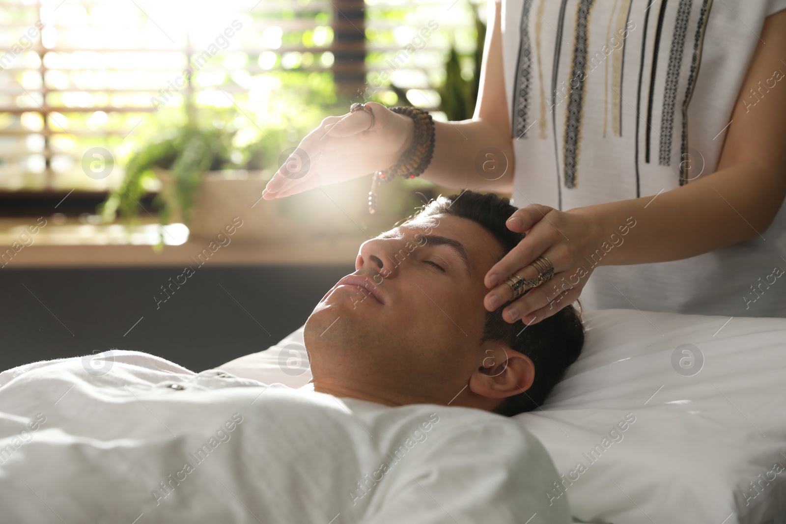 Photo of Man during healing session in therapy room