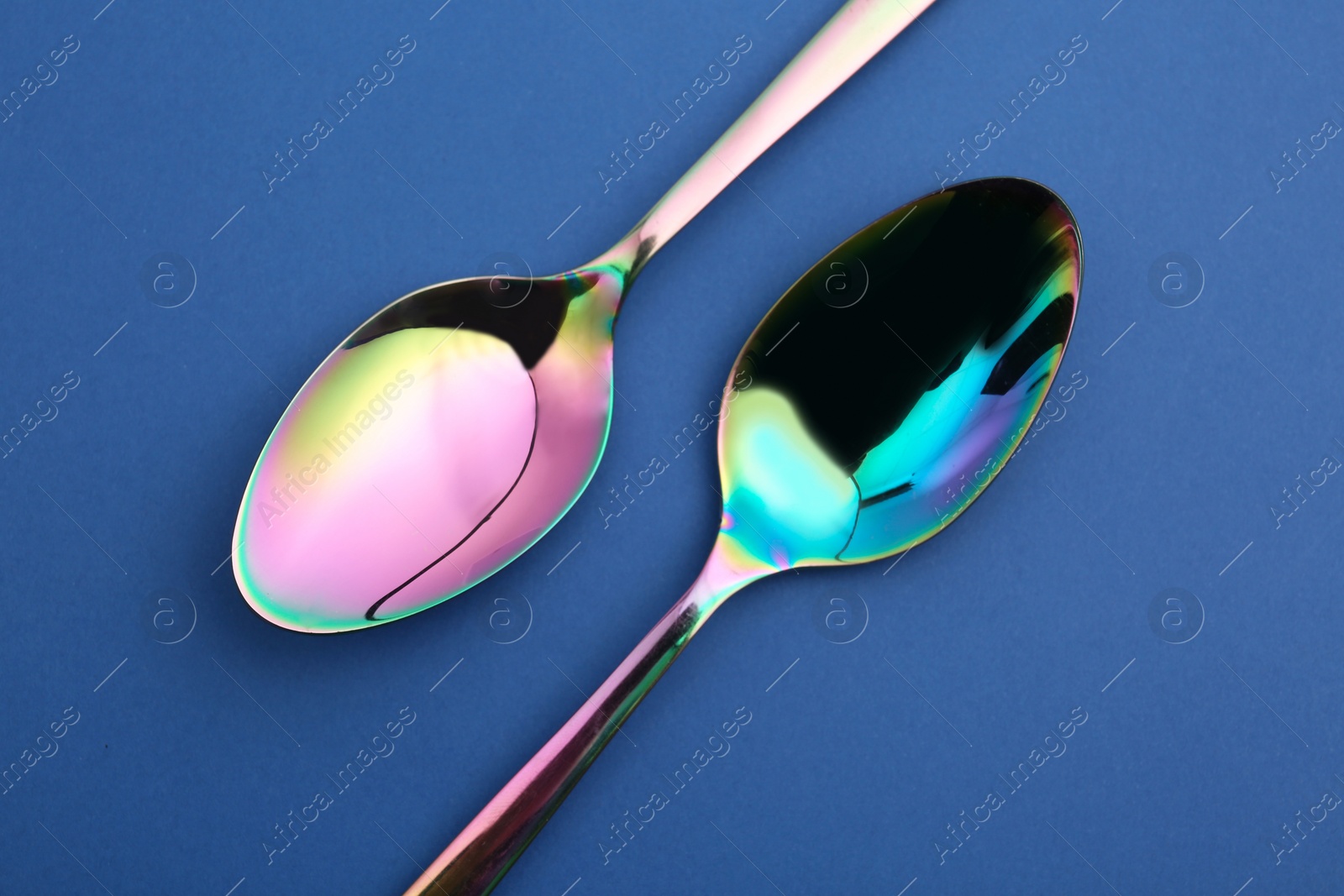 Photo of Clean tablespoons on color background, flat lay