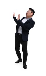 Businessman in suit posing on white background, low angle view