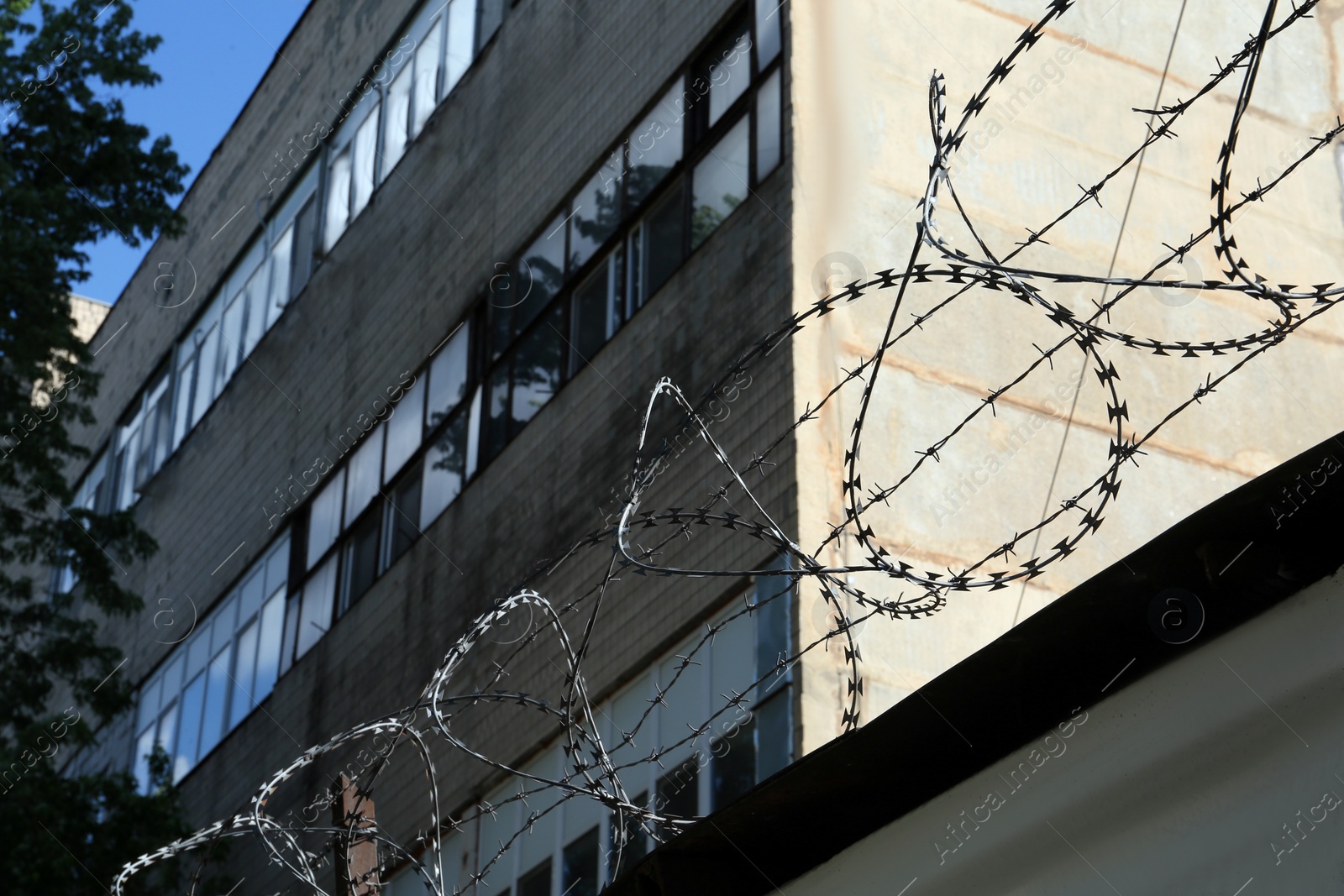 Photo of Metal barbed wire near private property outdoors