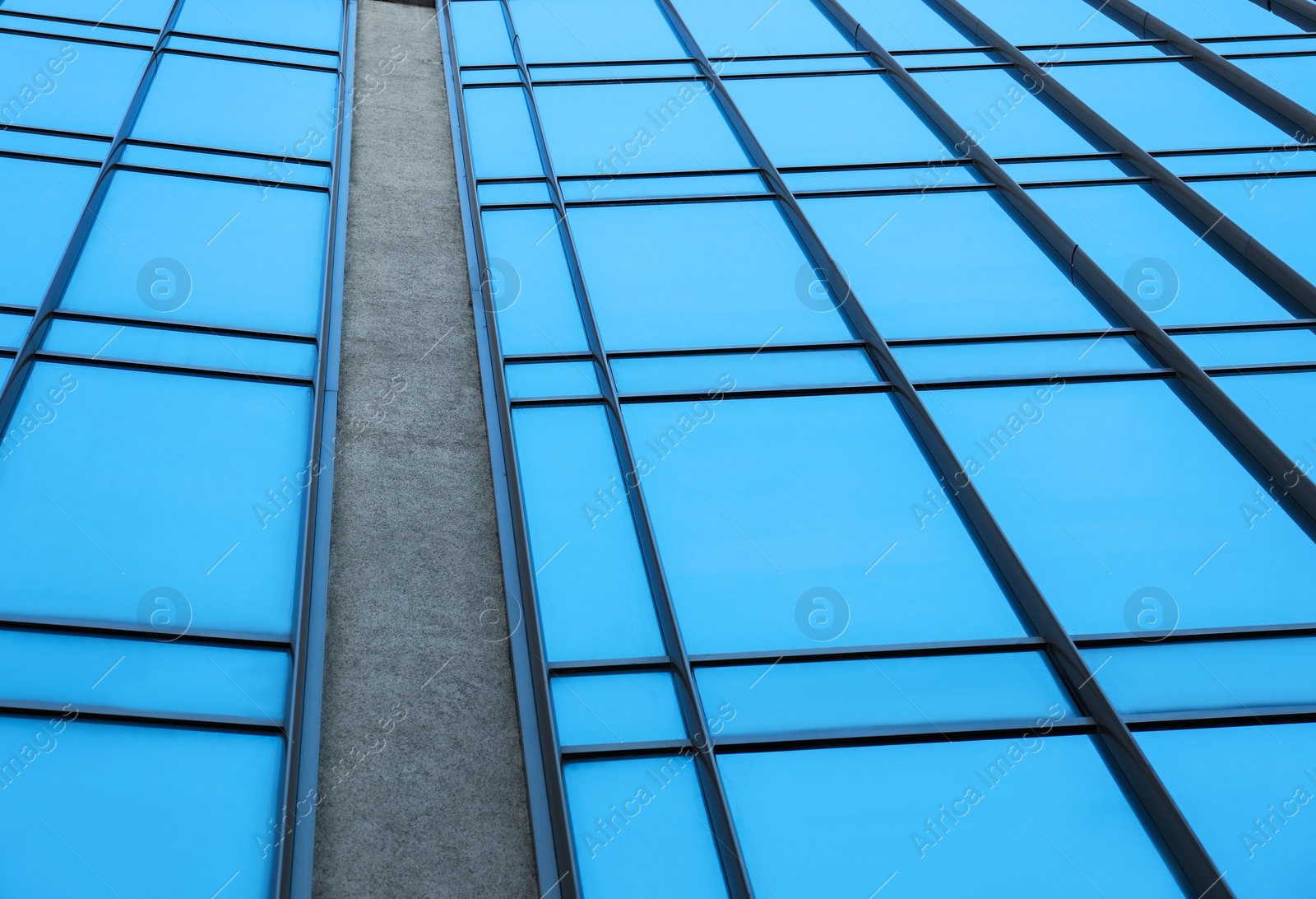 Photo of Modern building with tinted windows, low angle view