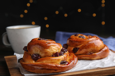 Delicious pastries and coffee on wooden table