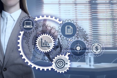 Image of Business process. Woman touching virtual screen with different icons in office, closeup
