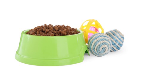 Photo of Different toys and bowl of food for pet isolated on white