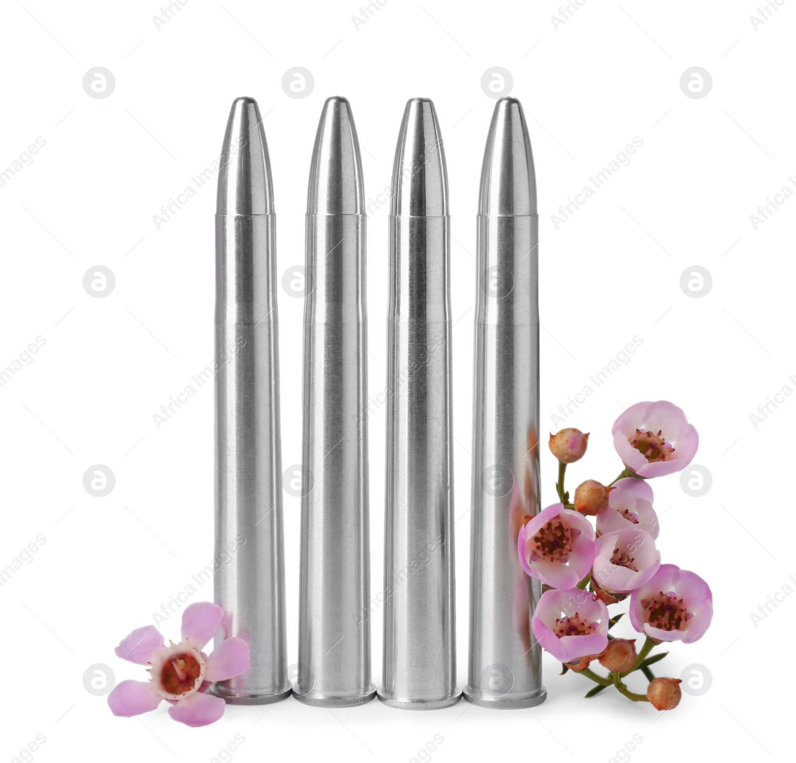 Photo of Metal bullets and beautiful flowers isolated on white