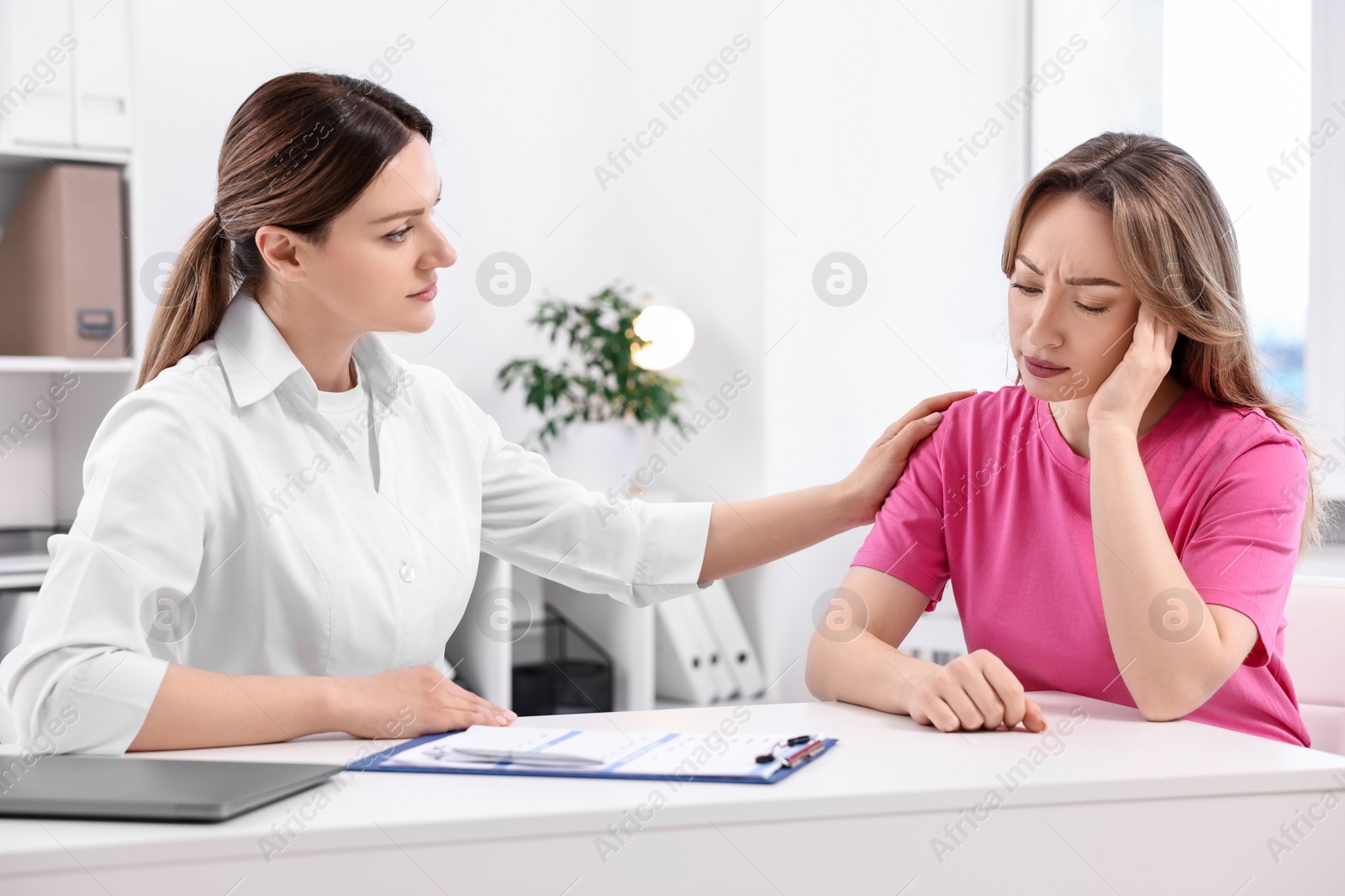 Photo of Mammologist's appointment. Doctor and woman in hospital