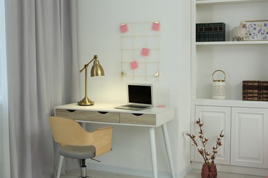 Photo of Stylish teenager's room interior with workplace and beautiful design elements
