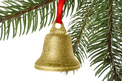 Photo of Christmas bell hanging on fir tree branch against white background